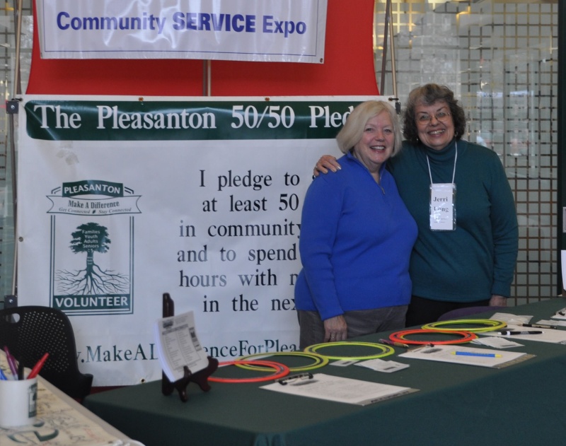 Jerri Long and friend at 50/50 pledge poster